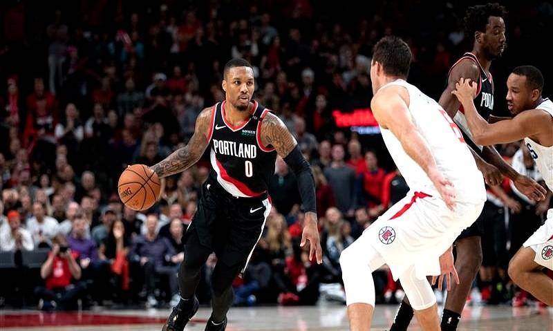 拓荒者客场大胜,利拉德带队展现统治力 拓荒者客场大胜,利拉德带队展现统治力